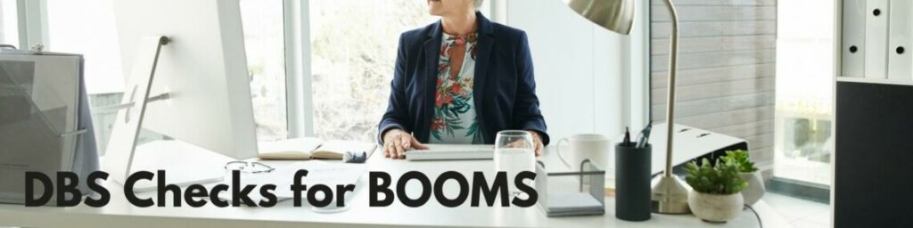 woman sat at desk with text over